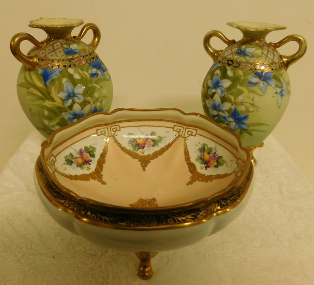 3 Pieces of Hand Painted Nippon: 3 Pieces of Hand Painted Nippon including; pair vases, 7 1/2" h. each and a footed round bowl, 8" diam. Condition; very good, no chips, cracks or crazing