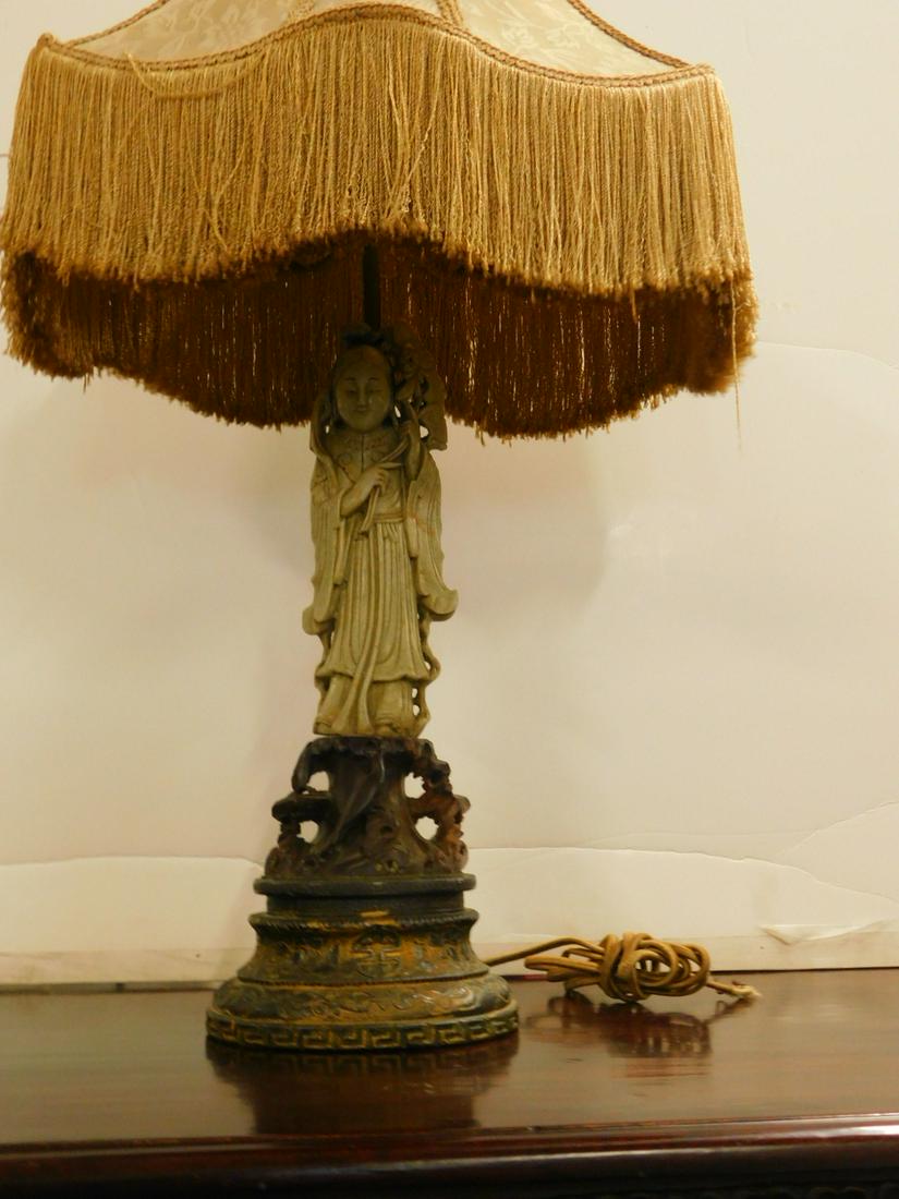 Chinese Soapstone Goddess Lamp: Chinese Soapstone Goddess Lamp, light tan standing figure on dark brown through carved stump form base again upon a fancy cast metal base, electrified, figure hgt 11 1/2", overall hgt 24 1/2", 19th/20