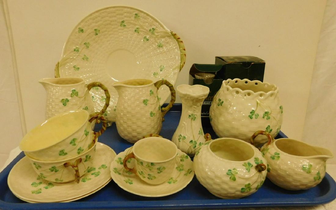 Large Lot Belleek Parian China Pieces: Large Lot Belleek Parian China Pieces, all with green clover leaf design including: two in original boxes,4" vase and 4" handled cup, plus small pitcher, cups and saucers, creamer and sugar, vases and
