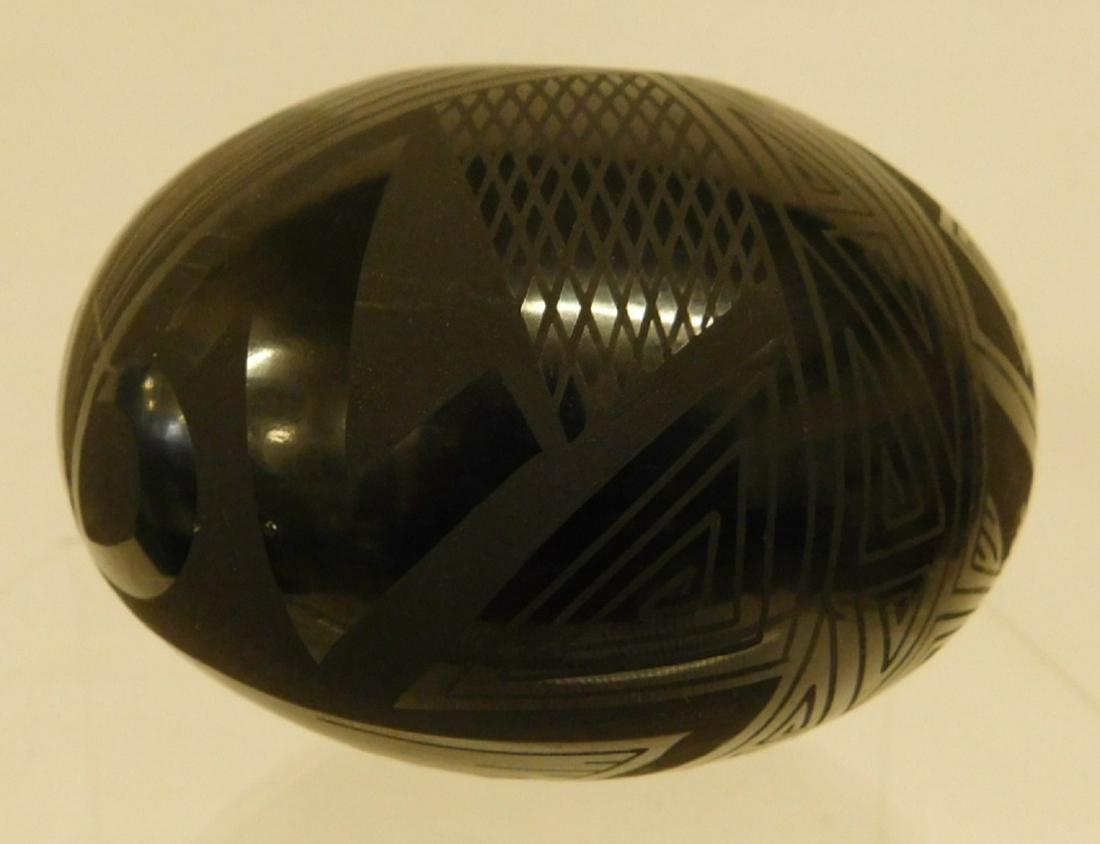 Native American Black on Black Vase: Native American Black on Black Vase, illegibly signed, possibly Maria Martinez, squat bulbous form, 4"d, 3"h, early to mid 20th C. CONDITION: Very good, expected wear.