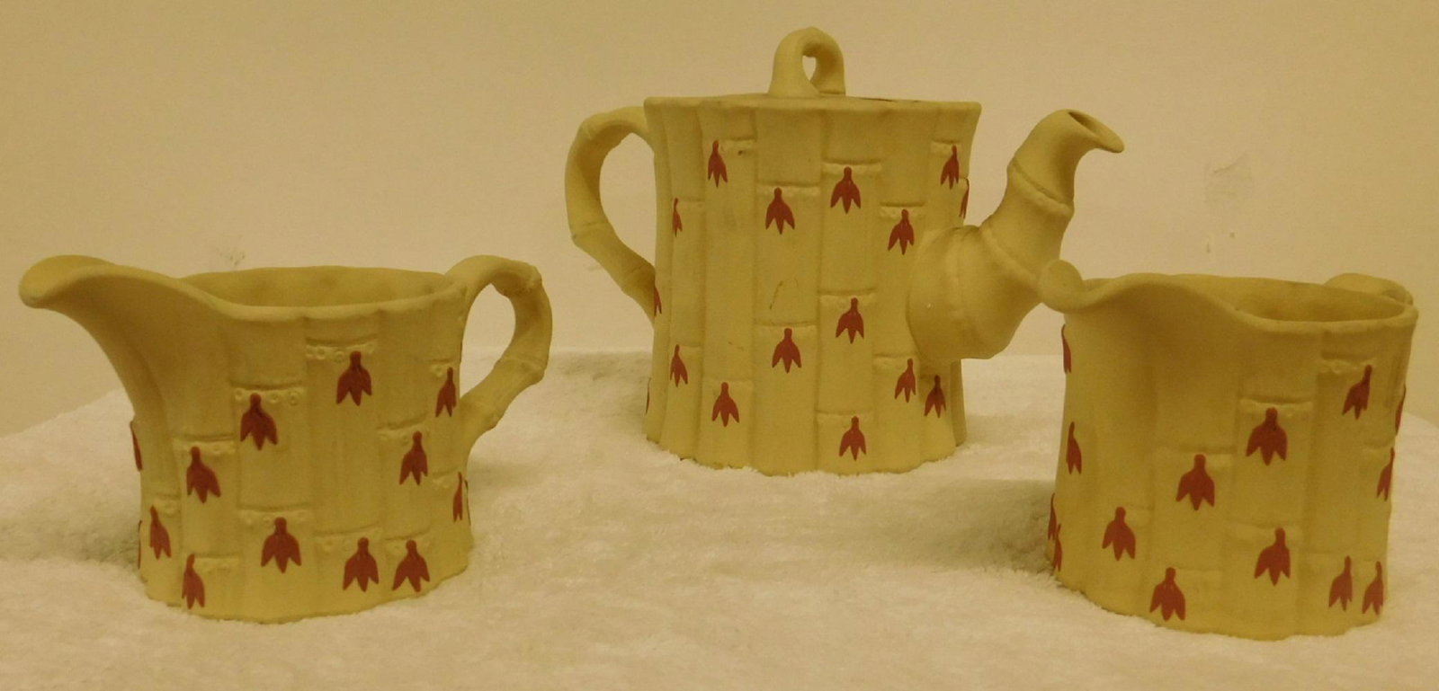 3 Pc Wedgwood Tea Set: Three Piece Wedgwood Tea Set, bamboo pattern, includes: tea pot and two creamers, mid 20th C. CONDITION: Very fine, no issues identified.