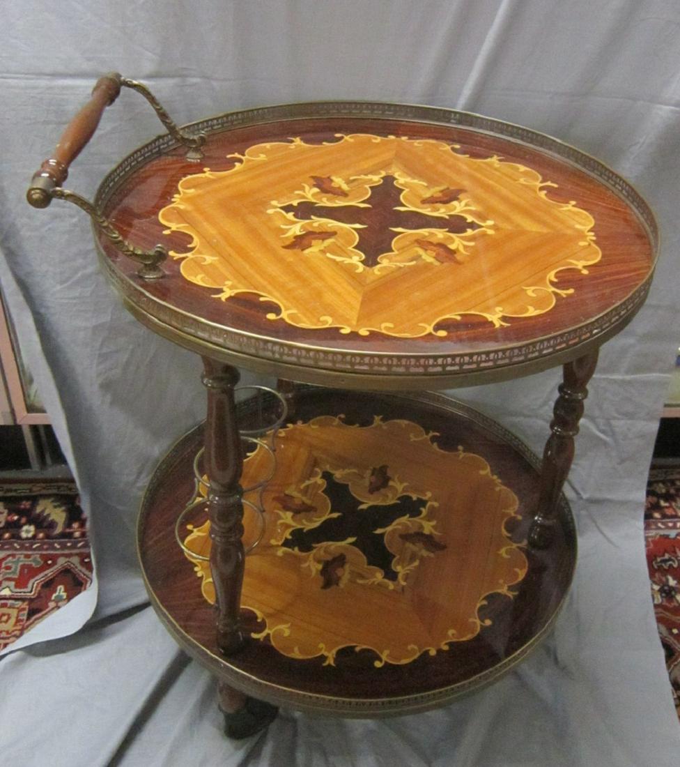 Italian Inlaid Tea Cart: Italian Inlaid Tea Cart, high glass finished mixed woods, brass mounts, casters, late 20th C, 23" x 21 1/2" x 29". CONDITION: Very good, no issues identified.