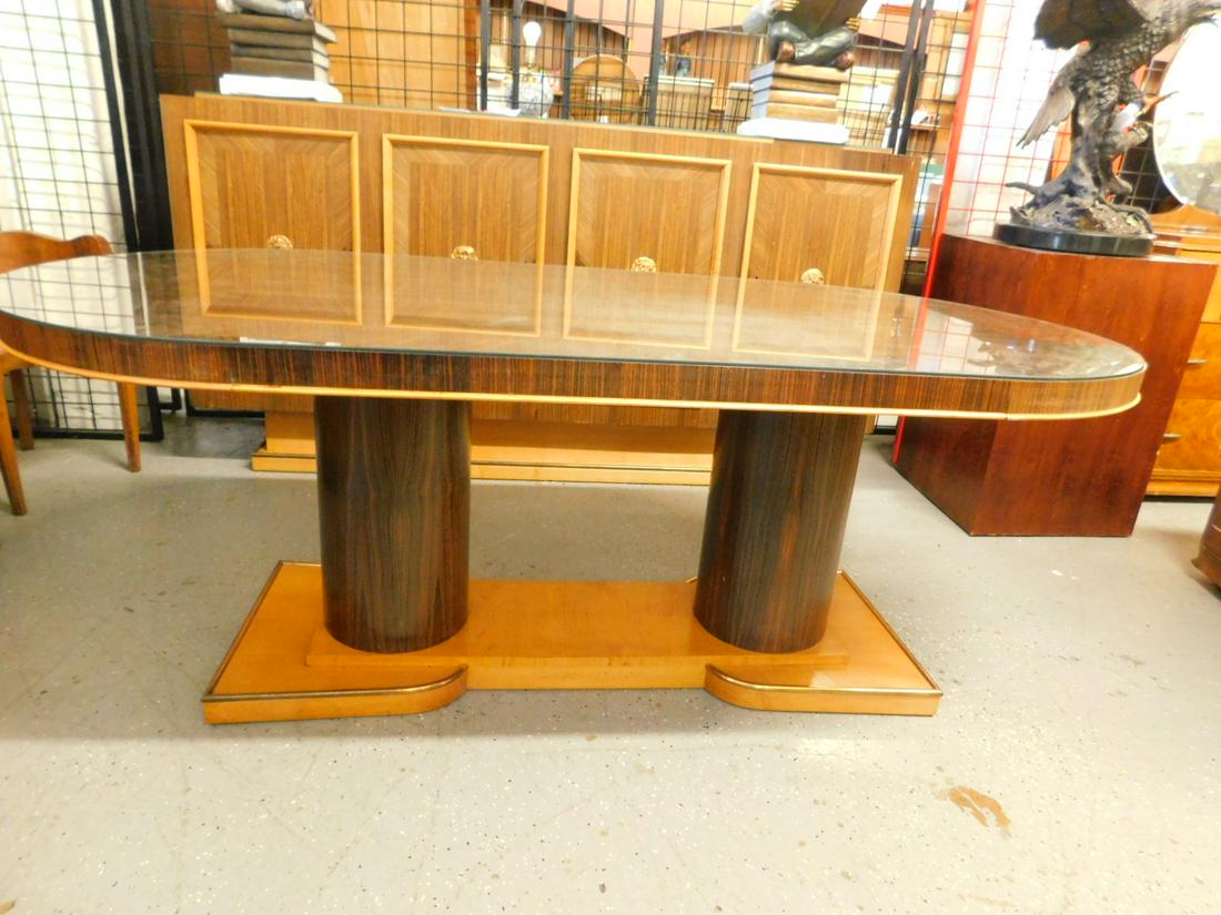 French Art Deco Dining Room Table: French Art Deco Dining Room Table, Macassar ebony veneers and sycamore, oval top with protective glass supported by two cylindrical columns on a platform base, with brass trim, circa 1930s, 78" x 37"