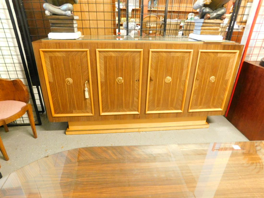 French Art Deco Buffet: French Art Deco Buffet, Macassar ebony veneers and sycamore, four doors with bronze mask mounts, glass protective top, circa 1930s, includes: receipt from Calderwood Gallery, Philadelphia, 86 3/4" x 2