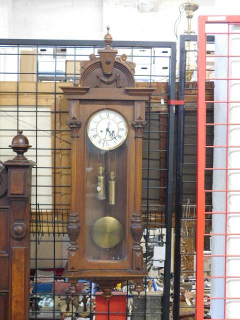 Vienna Regulator Clock: Vienna Regulator Clock, walnut Renaissance Revival style case with urn and reeded columns and finials, porcelain dial with Roman Numerals, brass two weight time and strike key wind movement, late 19th