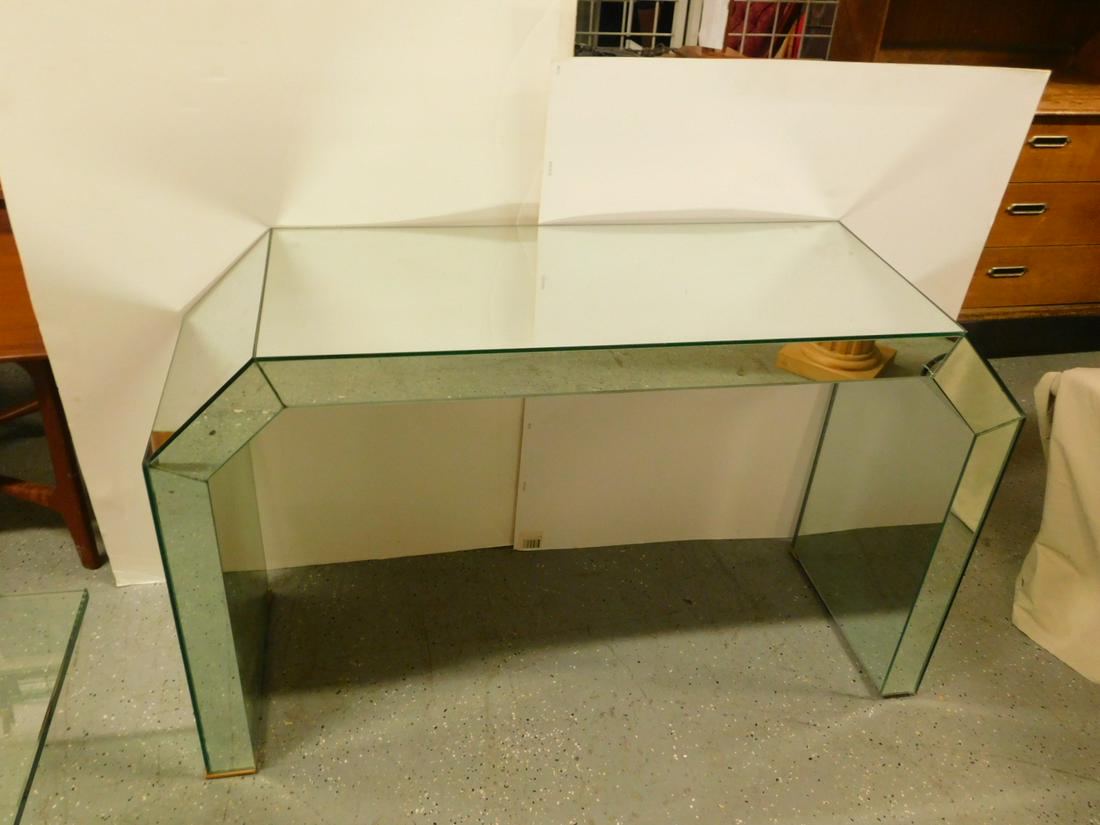 Modern Era Console Table: Modern Era Console Table, all mirrored, canted ends, late 20th C, 48 1/2" x 16 1/4" x 29 3/4". CONDITION: Very good, three small mirror cracks.