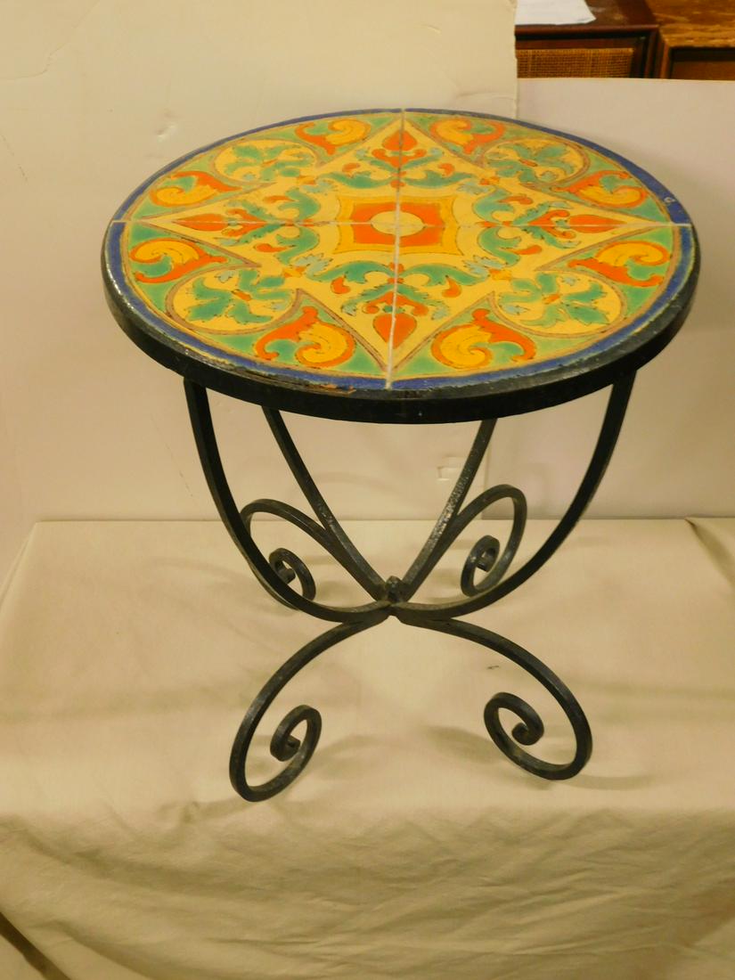 Tile Top Plant Table: Tile Top Plant Table, green yellow and orange tile top on wrought iron base, early 20th C, 17 1/2"d, 20 1/2"h. CONDITION: Very good, modest wear.