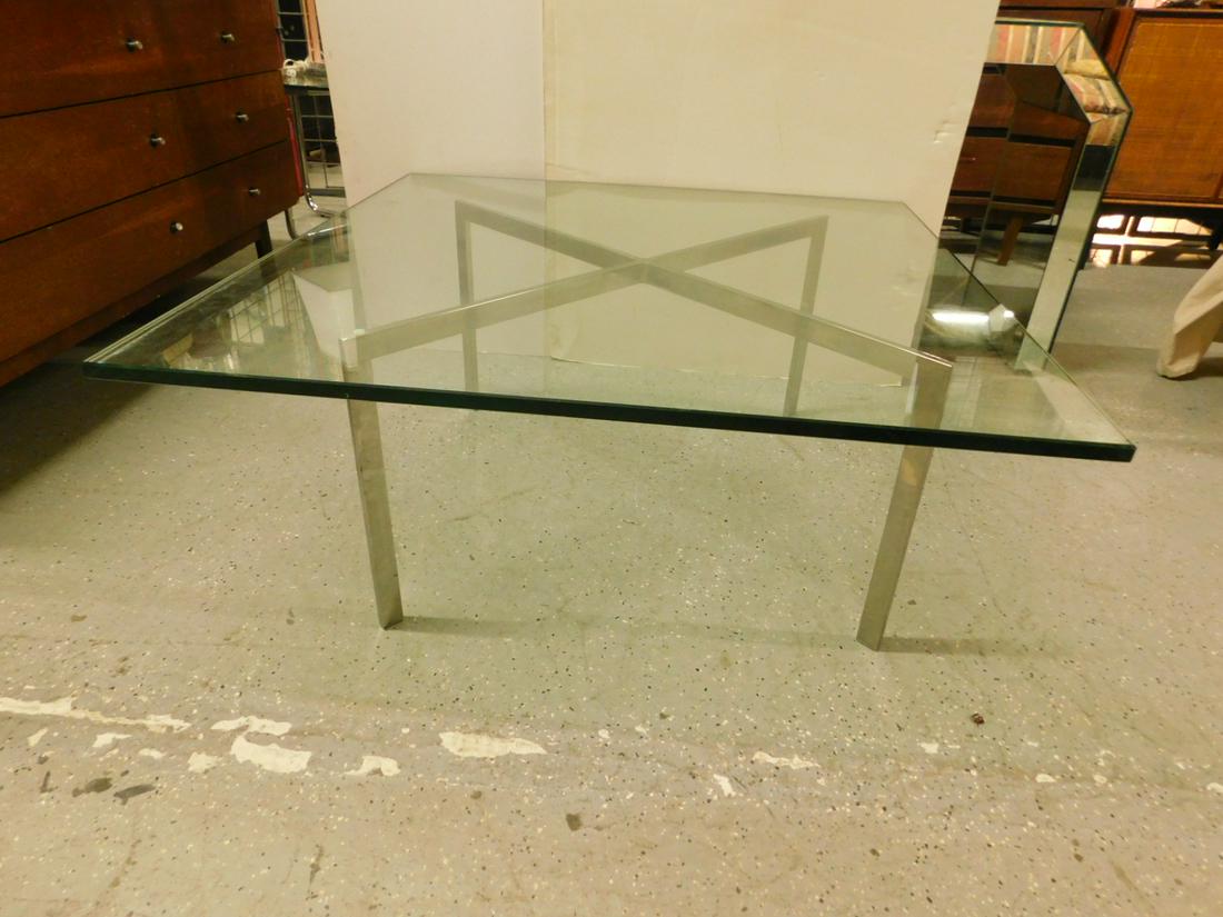Modern Era Coffee Table: Modern Era Coffee Table, plate glass 1/2" thick top rests on chrome flat rod "X" supported base, late 20th C, 40" x 40" x 16 3/4". CONDITION: Excellent.