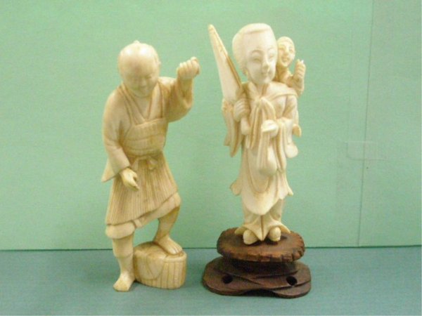 Two Chinese Ivory Carvings: Two Chinese ivory carvings, Fisherman with foot on basket, and lady with parasol & child, early 20th c., hgt 4 1/8", 4 1/4", [30] No International Shipping