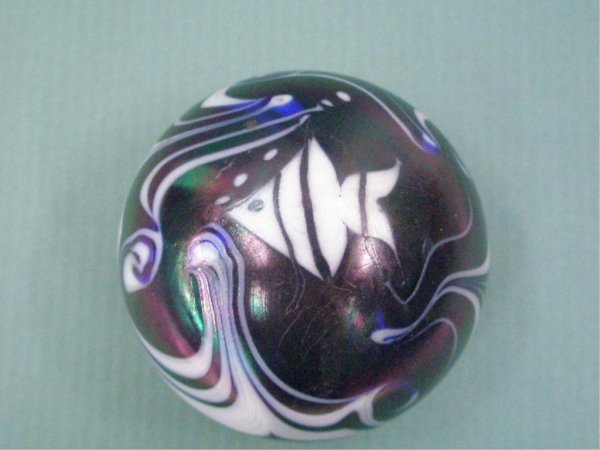 Contemporary Art Glass Paperweight: Grant signed on base contemporary art glass 2 1/2" paperweight, iridescent purple w/white fish & swirl design