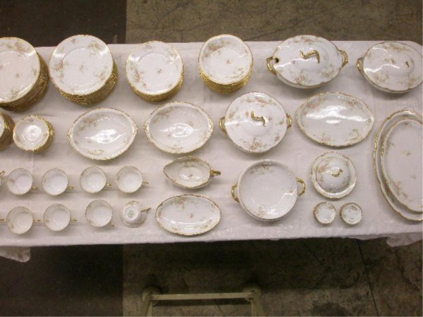 Theodore Haviland Limoges China Set: Theodore Haviland Limoges floral decorated 95 piece china set, (10) 10" dinner plates, (10) 9" luncheon plates, (11) 8" salad plates, (12) 7 1/2" soup bowls, (9) 5" fruit/desert bowls, (10) cups & (11