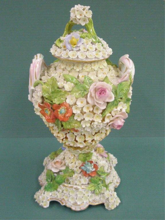 Saxonian Porcelain Floral Urn: Late 19th/early 20th c. Carl Thieme Saxonian Porcelain 8" double handled covered urn w/overall applied floral body, original stopper in lid to hold lid in place