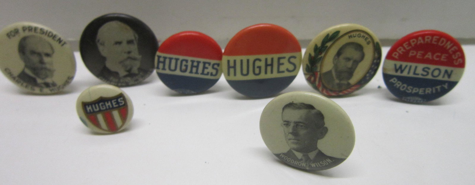 W. Wilson & Charles E. Hughes Campaign Buttons: W. Wilson and Charles E. Hughes Campaign Buttons, Presidential including: Woodrow Wilson photo button and Wilson Preparedness, Peace, Prosperity, 3/4" each,plus three Charles E. Hughes photo buttons, 
