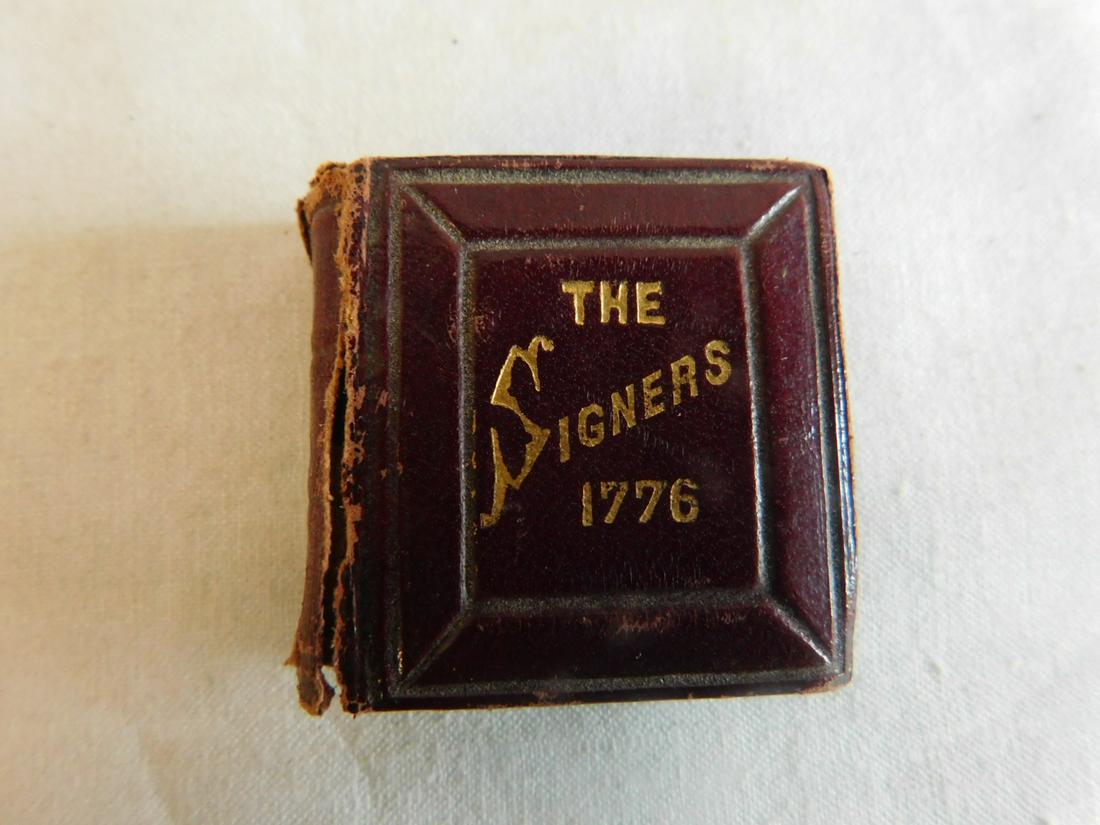 Mini Book - "The Signers": Mini Book - "The Signers" "To The Declaration of Independence chromed by Max Rosenthal, Phila, 1876", tooled leather bound, accordion fold out portrait photo pages, 1 3/8" x 1 1/2". CONDITION: Cover s