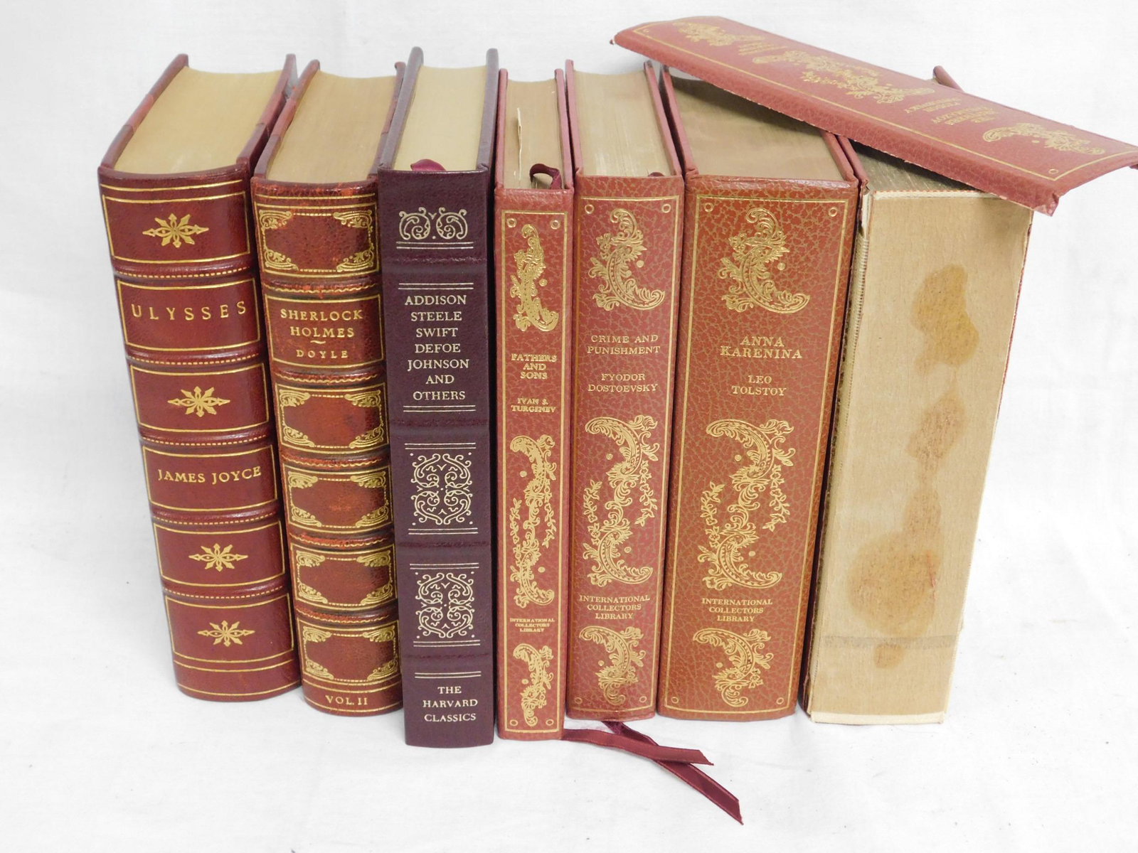 7 Hardbound Books: Seven Hardbound Books includes; Ulysses - James Joyce - Random House, NY, 1980 leather bound; The Complete Sherlock Holmes - Doyle, VI II - Doubleday & Co. 1956 leather bound; English Essays from P. S