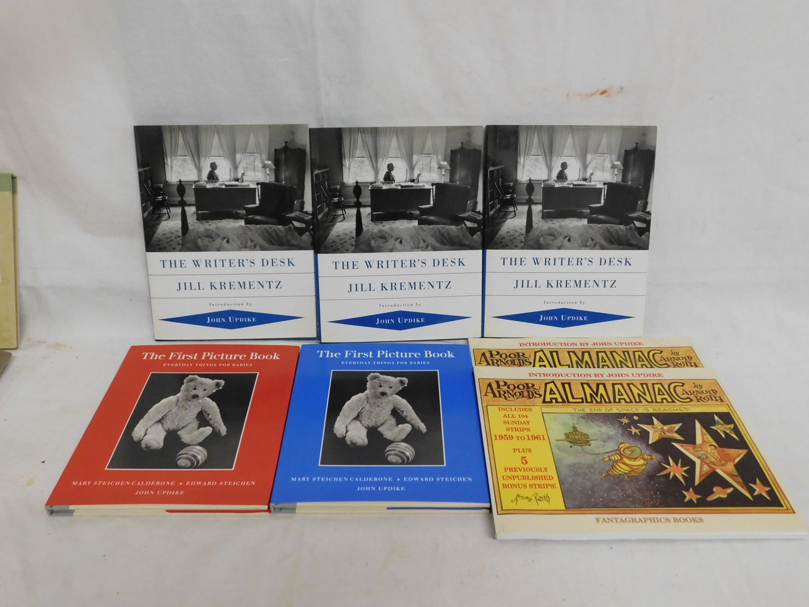 Lot of 7 books, Calderon,: [2 items] Calderon, Mary Steichen, Edward Steichen, John Updike, The First Picture Book - Everyday Things for Babies, Fotofolio Whitney, New York, 1991. Two copies: one in the red, one in the blue jac