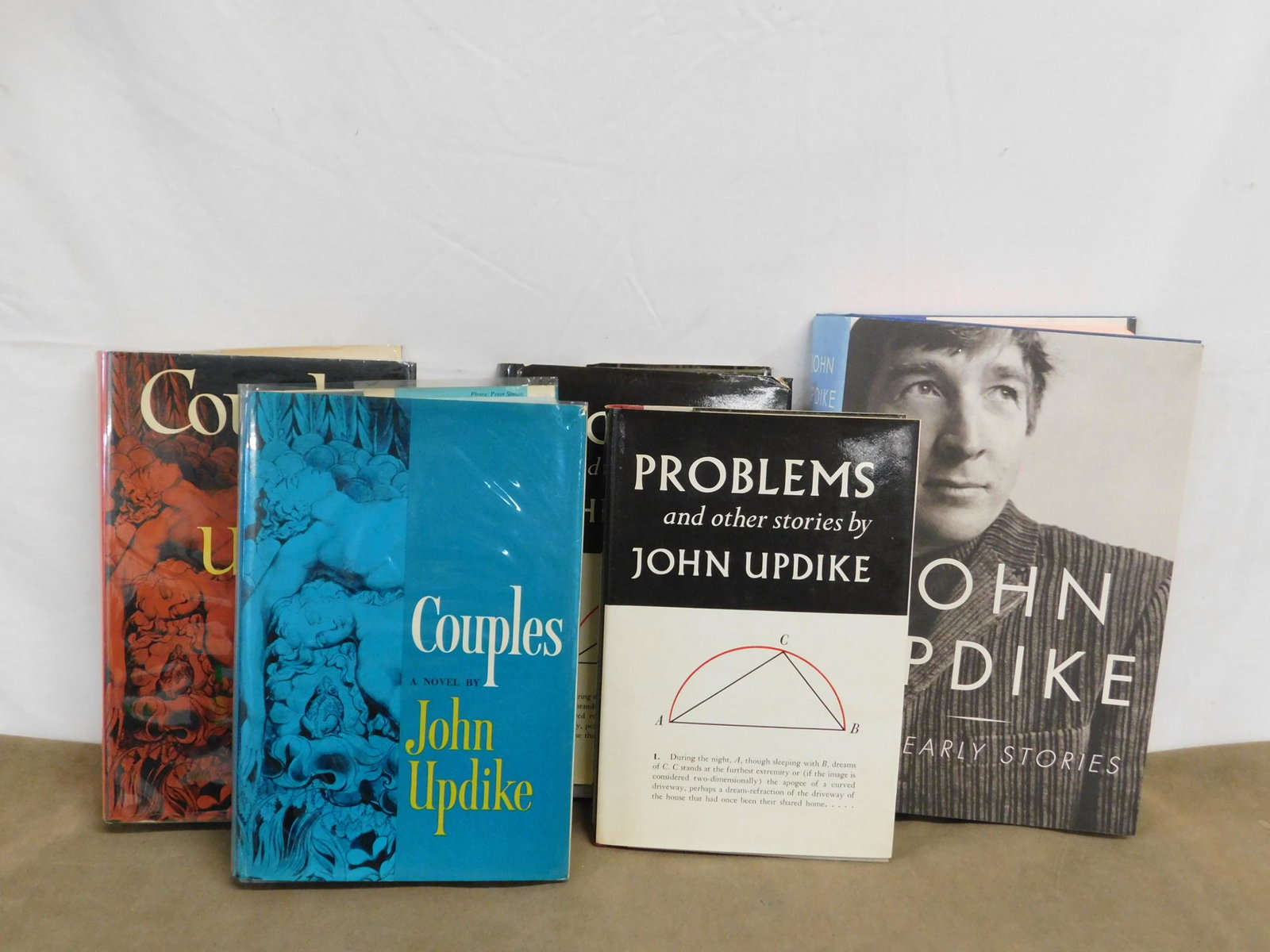 Updike Books Lot: Updike, John, The Early Stories, Alfred A Knopf, New York, 2003. First printing. Signed by the author, inscribed to collector Albert J Raman. De Bellis & Broomfield A189a. CONDITION: Fine in near fine
