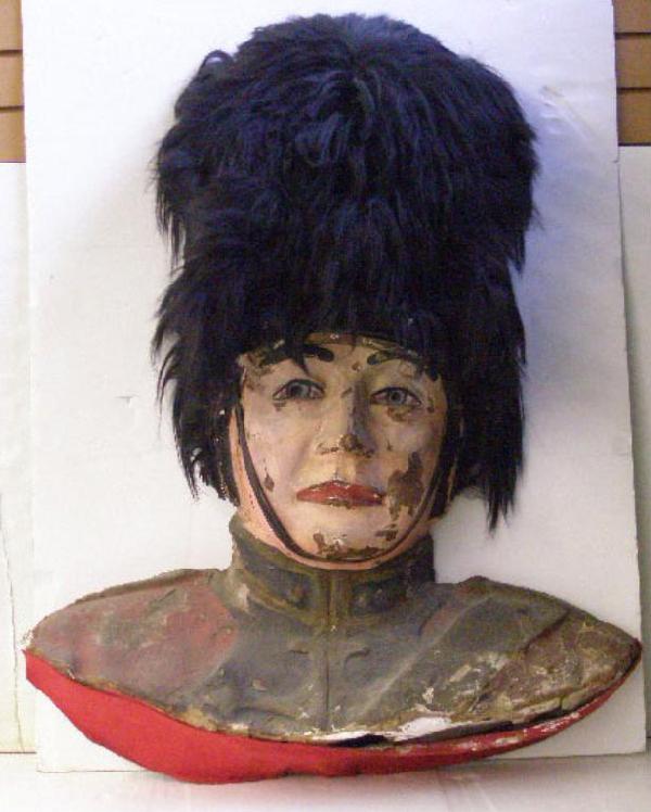Paper Mache "Bobbie" Head, Polychromed: Paper mache "Bobbie" head, polychromed, horsehair? hat, felt base, early 20th C., possibly from a carnival or old float, approximately, 39" hgt; 31" l