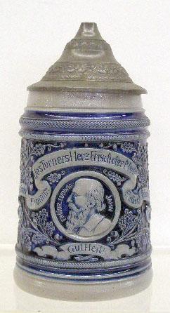 German Stoneware Beer Stein: Early 20th c. German blue & grey stoneware 1/2" litre 6 1/2" beer stein w/metal lid, center medallion portrait of Friedrich Ludwig.