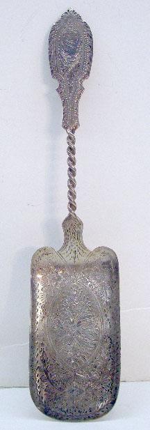 Gale & Willis Sterling Silver Vegetable Server: Late 19th c. Gale & Willis sterling silver 9 1/2" vegetable server w/floral chaised design, monogram W on handle, 2.23 troy ounces.