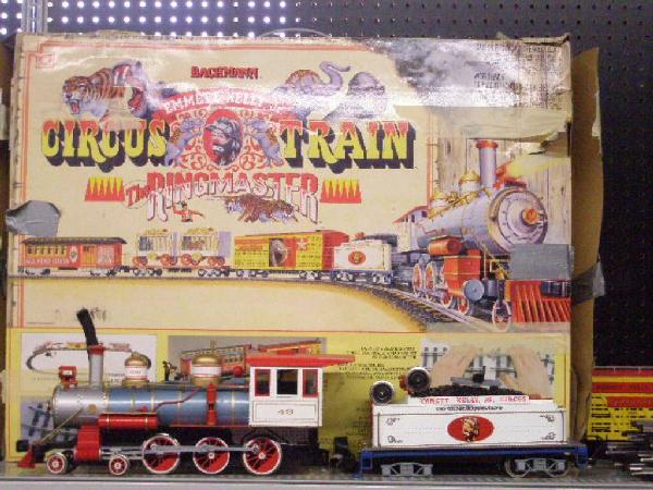 Bachman G Scale Emmett Kelly Train Set: Bachman G scale Emmett Kelly Jr. Circus Train Ringmaster 5 piece train set w/box. CONDITION: Front wheels detached on tender, detached door on Advertising car, no elephant in Elephant car, no guerilla