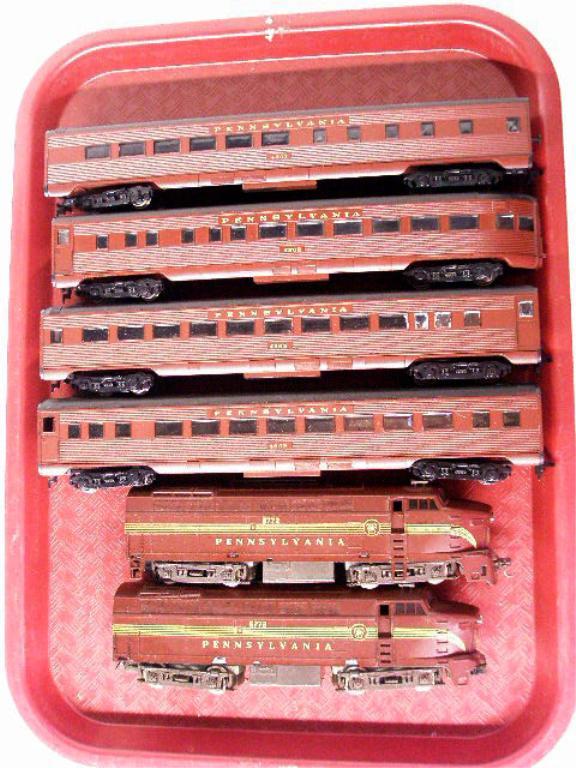 Pennsylvania HO Scale Train Set: Austrian & unmarked Pennsylvania Railroad HO scale six piece train set, ROCO Austrian #5772 engine & dummy unit, & four unmarked #4903 Passenger cars. CONDITION: Dummy unit has loose cab & others are