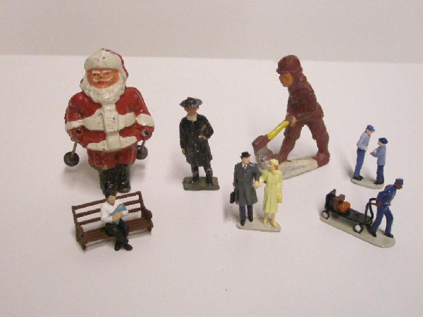 Vintage Lead & Metal Figures: Seven assorted vintage painted lead & metal figures. CONDITION: Santa is missing skis & preacher & man w/axe have paint loss.