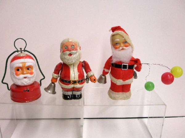 1950's & 1960's Japanese Santa Claus Toys: Three 1950's & 1960's Japanese Santa Claus toys, tin wind-up bell ringer, felt & plush face bell ringer & battery operated two-face lamp. CONDITION: Bell ringers work, lamp does not work, tin bell rin