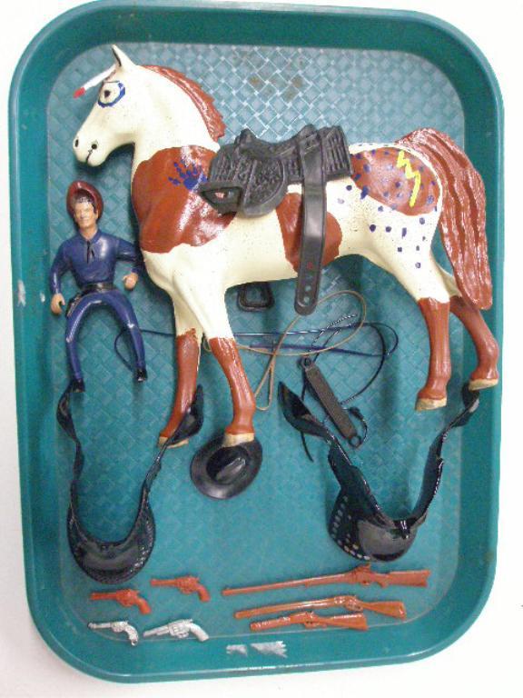 1960's Hartland Figure & Accessories: 1960's Hartland Plastics miniature Western figure, horse, 2 saddles, hat, 3 rifles, 4 pistols & bridle. CONDITION: Loss on figure & horse has been painted