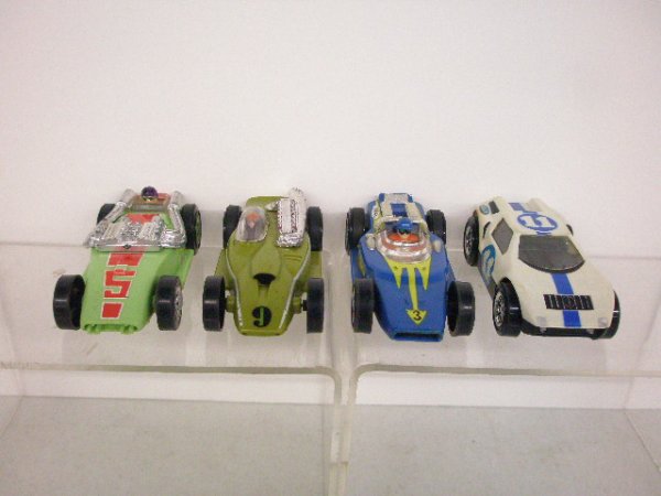 1970 Ideal Slot Cars: Four 1970 Ideal slot cars. Condition: All have some form of wear from usage.