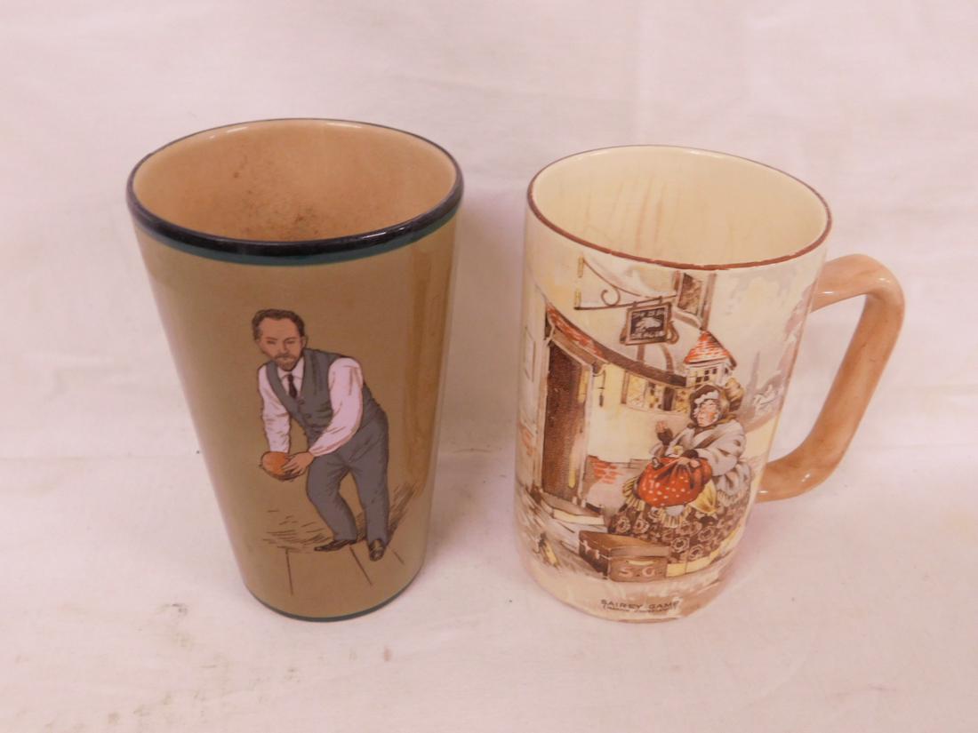 2 Beakers: 2 Beakers, includes; unmarked cone form in olive green with painted Bocce player, 4 7/18", and Newhall - Hanley England mug with handle and a "Shirey Gamp & Mr. Bumble transfer print, 4 1/2"h. CONDITI