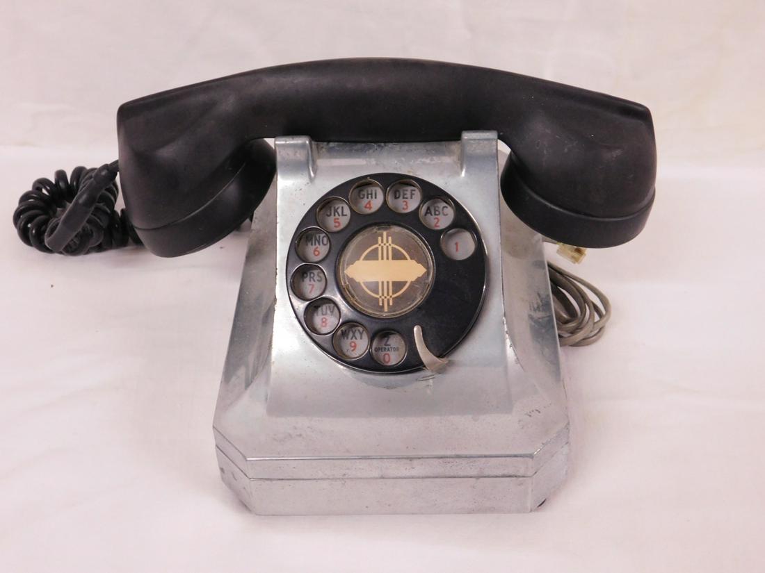 Vintage Telephone: Vintage Telephone, nickle finished heavy metal case with black bakelite hand receiver, manual dial, circa 1940-50s, 8 1/4" x 5 1/2" x 9 1/2". CONDITION: Used cond. Some metal nicks and scratches, appe