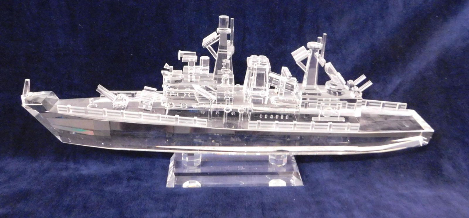 Crystal Battleship: Crystal Battleship, no maker's marks, 20" long ship with guns, radar and railings, rests upon two columns on plinth base, 9"h, late 20th C. CONDITION: Chip on a corner of plinth base.