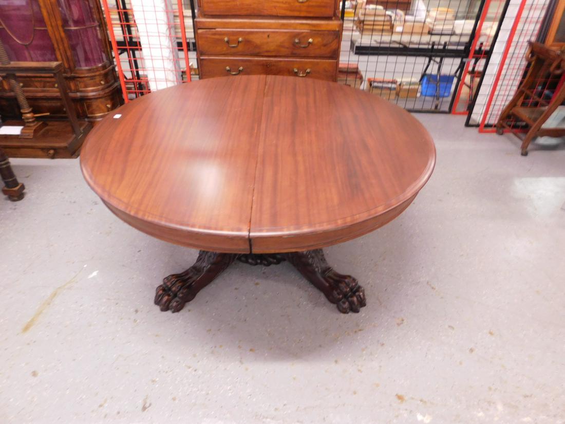 Lion Carved Dining Room Table: Lion Carved Dining Room Table, mahogany 60" d molded edge round top rests upon two massive elaborately carved lion mask, acanthus twin claw footed bases. [12] CONDITION: Very fine, no leaves, no cente