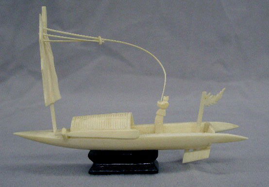 Chinese Carved Ivory Junk: Chinese carved ivory junk, fisherman holding sail; wood base, mid 20th, 5"L. No International Shipping. [25]