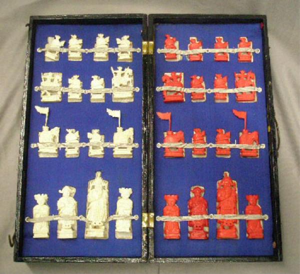 Chinese Ivory Chess Set: Chinese ivory chess set, in black lacquered & gold chess board box, red & white figures from 1' 1/2 to 3" 3/4, early 20th C. No international shipping.