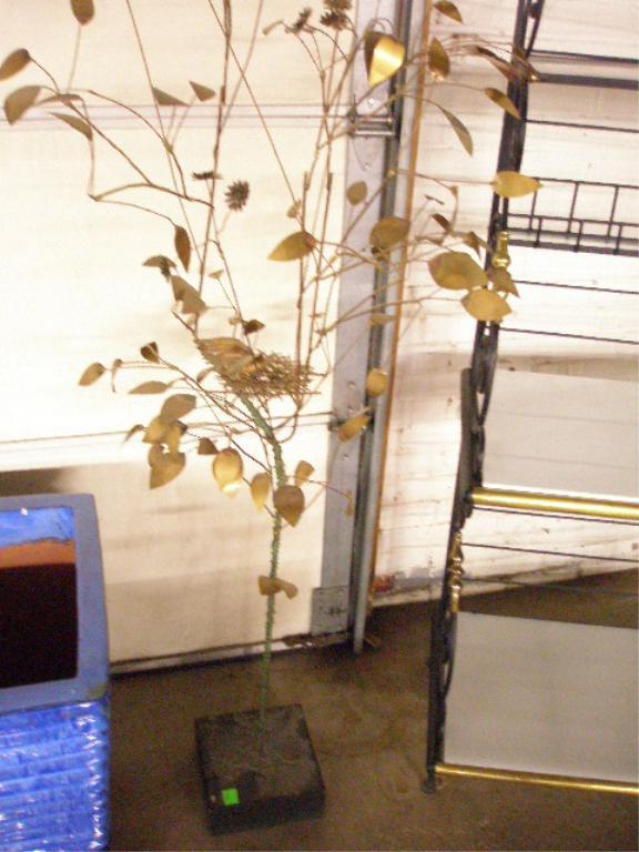 Curtis Jere Tree Sculpture: Curtis Jere signed 69" x 32" tree sculpture, metal leaves on branching metal arms over a black wood base, features a bird in a nest with eggs, signed and dated C. Jere 72 on metal tag