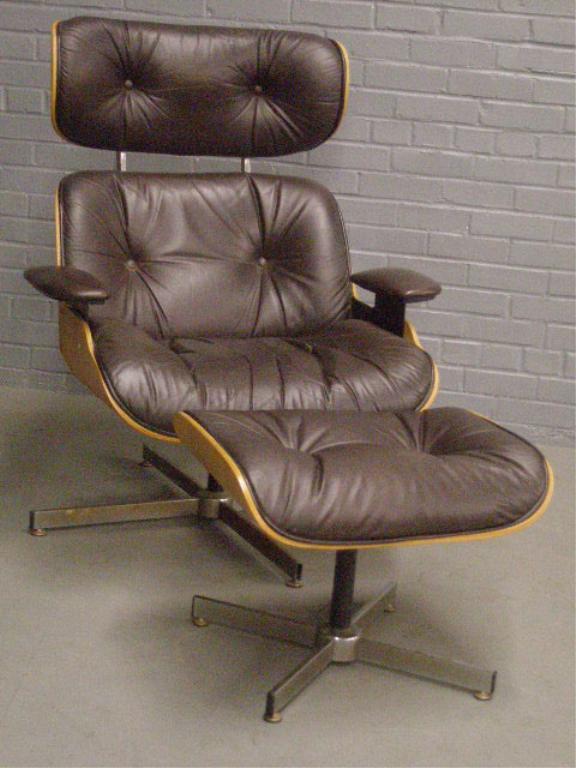 Charles Eames Style Armchair and Ottoman: Charles Eames style armchair and ottoman, by Selig Manufacturing, leather, laminated wood, steel chromed. Late 20th c. 39:" tall, 32"w, 32" D.