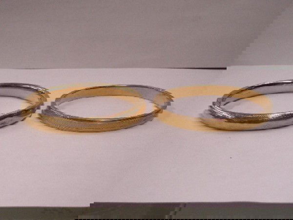 Two 14k YG Bangles Bracelets: Two 14k yg Bangles bracelets, chaised designs, 1 engraved, "EMY, Dec. 25-1913". Total 17 DWT.