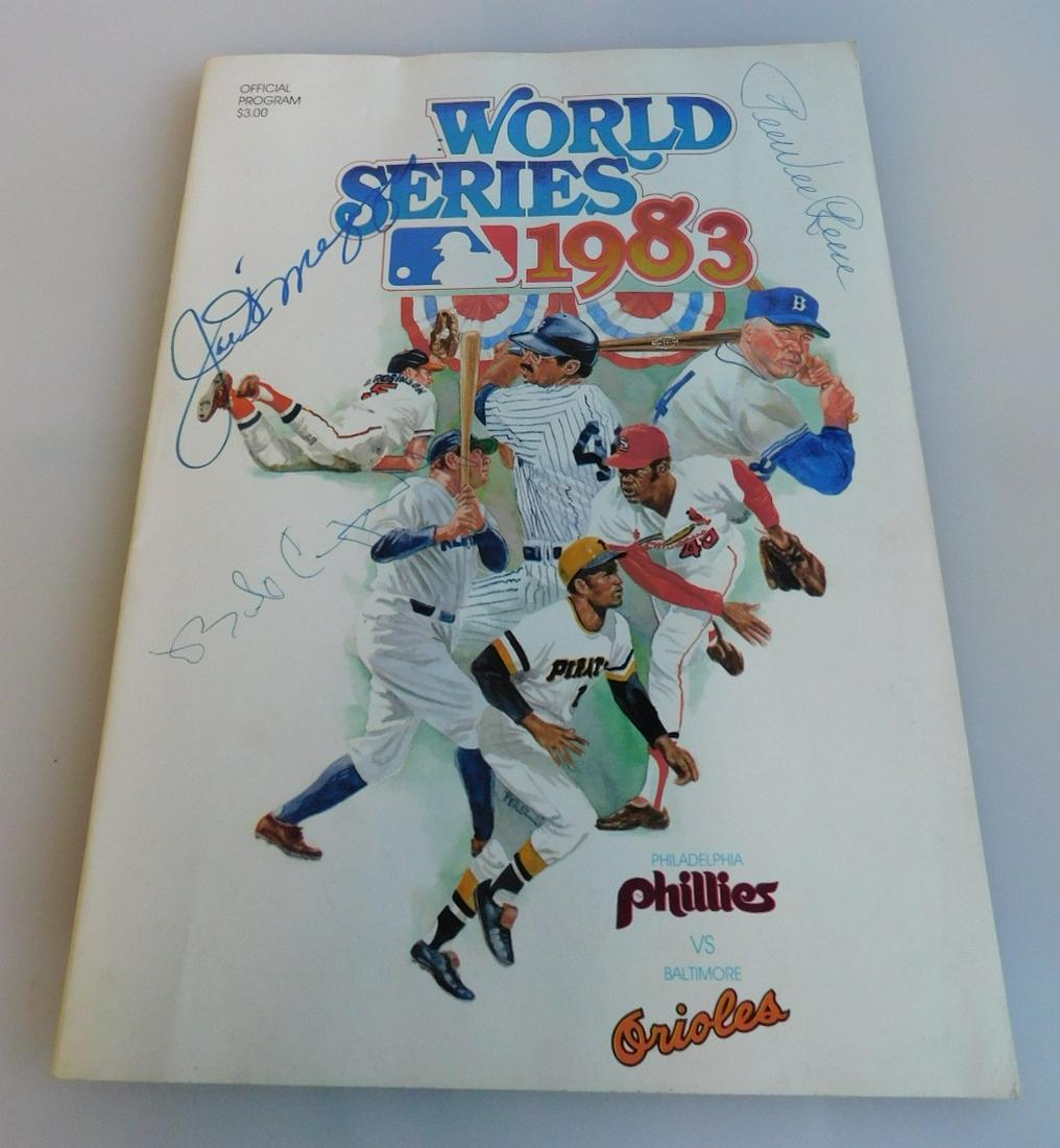 Signed 1983 World Series Program: Signed 1983 World Series Program, signed on cover by Joe DiMaggio, Pee Wee Reese and one illegible (Bob C....), $3.00 Official Program, Philadelphia Phillies vs Baltimore Orioles (signed in ink and ma