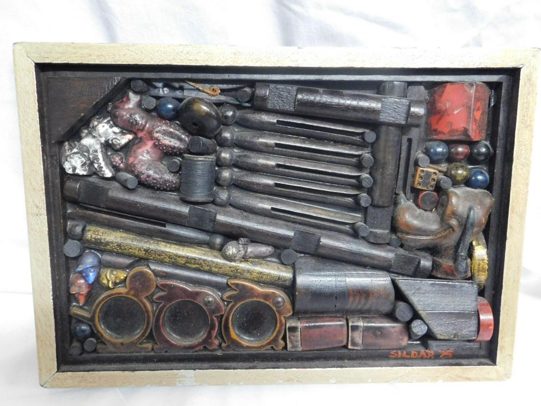 Wm Peter Sildar Plaque: Wm Peter Sildar Plaque, Collage of wood and other material objects, titled and signed on verso "The Two of Us Once Played Here Together III", 1975, 13 1/2" x 9 1/2" x 1". CONDITION: Very good.