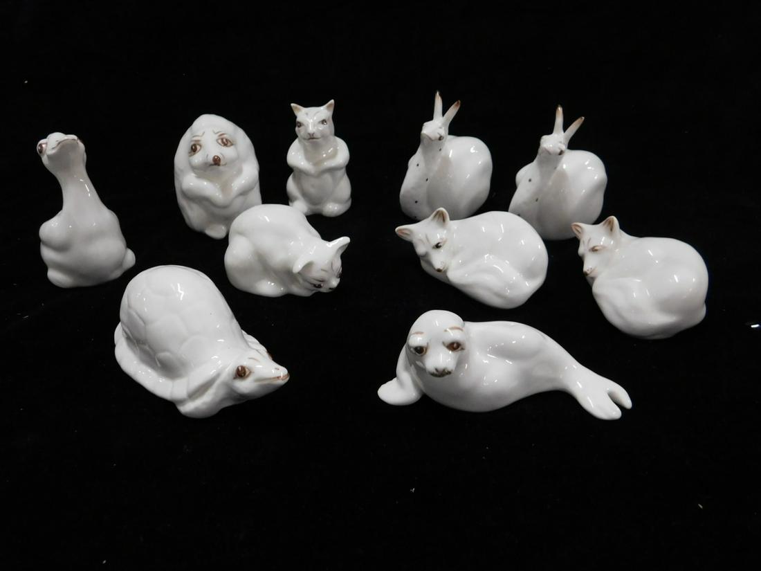 10 Coalport Bone China Animals: Ten Coalport Bone China Animals, includes: seal, tortoise, two foxes, duck, two snails, squirrel, hedgehog and cat, includes: eleven boxes (one extra). CONDITION: Like new.