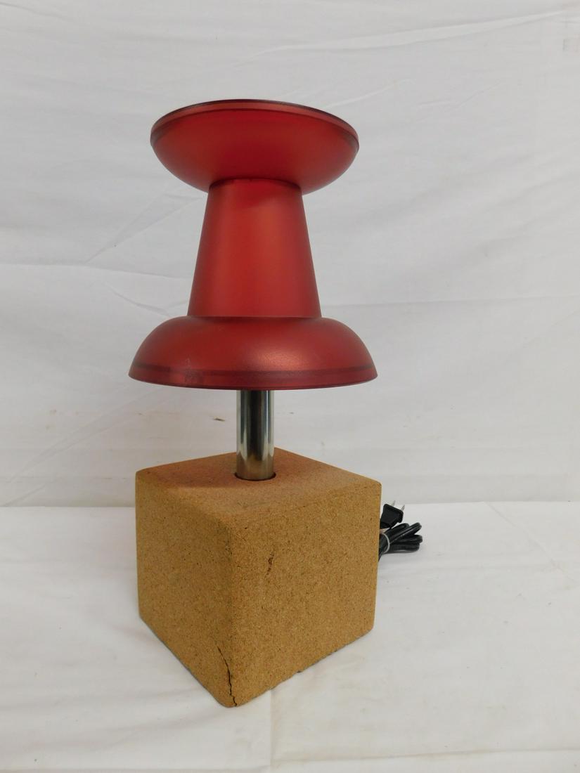 Thumb Tack Lamp: Thumb Tack Lamp, by Visual Gram, model VG8101, red lucite, metal and cork, 21st C, 7 1/2" x 7 1/2" x 15 1/2". CONDITION: Very good, light usage.