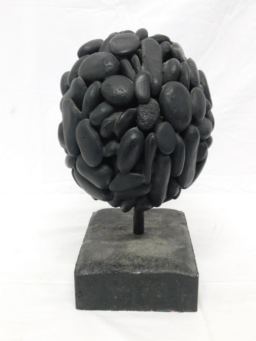 Contemporary Stone Sculpture: Contemporary Stone Sculpture, depicts black painted polished stones, joined in a spherical shape and suspend by a metal rod on a concrete base, no maker's marks, late 20th C, 13 1/2" x 9 1/2" x 6 1/2"