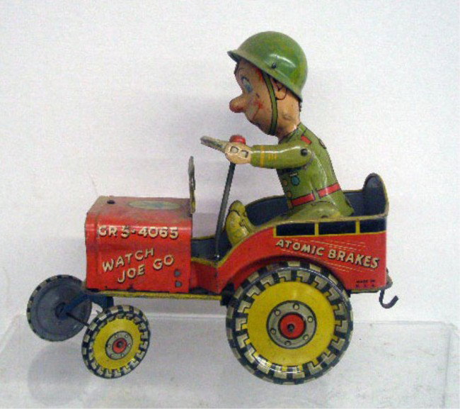 Unique Tin Wind-Up G.I. Joe Jouncing Jeep: 1940's Unique Art Manufacturing Company lithographed tin wind-up 7" G.I. Joe & His Jouncing Jeep.
