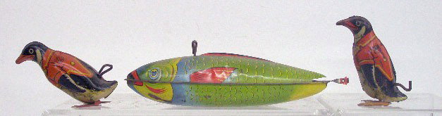 Chein Tin Wind-Up Penguins & Fish: 1940's & 1950's J. Chein & Co. lithographed tin wind-up (2) 3 7/8" penguins & 10" fish.