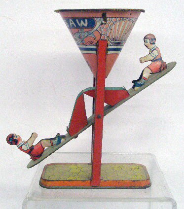 Chein Tin See Saw Sand Toy: 1940's J. Chein & Co. lithographed tin 7 1/4" See Saw sand toy.