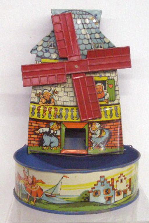1940's T. Cohn Tin Windmill Sand Toy: 1940's T. Cohn Inc. lithographed tin 8" windmill sand toy.