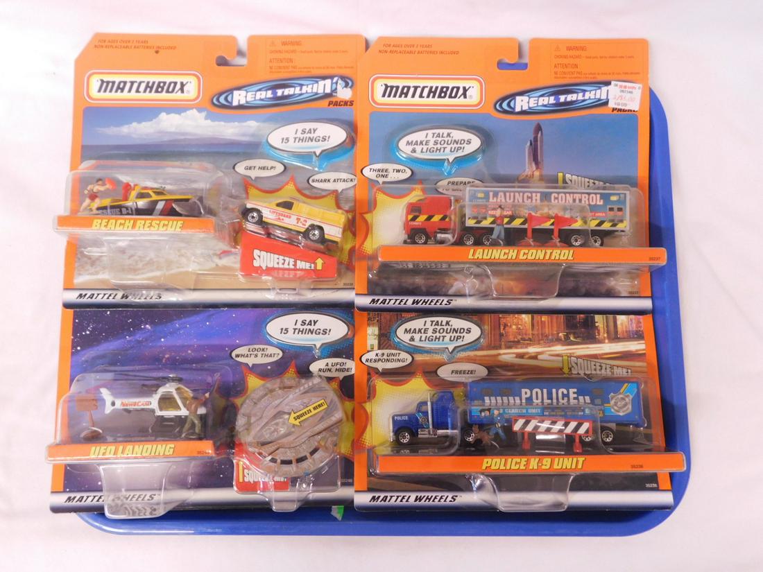 Matchbox 1999 Real Talkin Packs NOS: Matchbox 1999 Real Talkin Packs NOS, new old stock including: Launch Control, Police K-9 Unit, UFO Landing and Beach Rescue. Condition; new old stock, packages may have minor wear