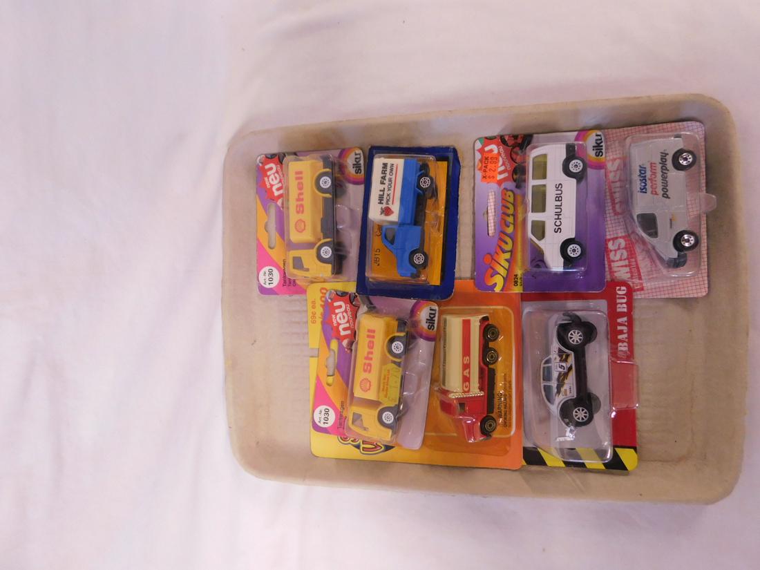 7 Assorted Vehicles NIP: 7 Assorted Vehicles NIP, new old stock, diecast scale models including: Tonka Baja Bug, Swiss Ford Transit, Siku Club School Bus, Speed Wheels Series X, Hill Farm Canvas Back Truck and (2) Nouveau Tan